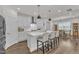 Modern kitchen with a center island, stainless appliances, and open dining area at 2969 Thirlestane Dr, Apex, NC 27502