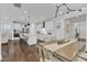Bright, open kitchen featuring white cabinets, stainless steel appliances, and a large island with seating at 2969 Thirlestane Dr, Apex, NC 27502