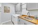 Functional laundry room with modern washer/dryer, sink, and ample storage cabinets at 2969 Thirlestane Dr, Apex, NC 27502