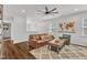 Cozy living area with hardwood floors, a comfortable leather sofa, and a plush rug at 2969 Thirlestane Dr, Apex, NC 27502