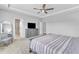 Main bedroom with a TV, dresser, and cozy chair, providing a comfortable and stylish retreat at 2969 Thirlestane Dr, Apex, NC 27502