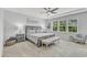 Serene main bedroom featuring a gray color palette, soft carpet, and natural light from the windows at 2969 Thirlestane Dr, Apex, NC 27502