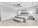 Relaxing main bedroom with gray furnishings, carpeted floors, and a calming ambiance at 2969 Thirlestane Dr, Apex, NC 27502