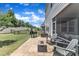 Cozy patio area with stone pavers, grill, outdoor furniture, and covered seating at 2969 Thirlestane Dr, Apex, NC 27502
