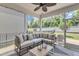 Inviting screened-in porch with comfortable seating and a ceiling fan for relaxing outdoors at 2969 Thirlestane Dr, Apex, NC 27502