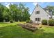 Lush backyard featuring a garden at 305 Lochridge Dr, Roxboro, NC 27573