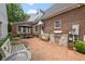 The backyard features a brick patio with built-in grill and seating area at 305 Lochridge Dr, Roxboro, NC 27573