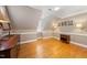 Bonus room featuring warm paint and beautiful wooden floors at 305 Lochridge Dr, Roxboro, NC 27573