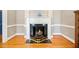 Elegant fireplace with marble hearth and decorative mantle, perfect for cozy evenings at 305 Lochridge Dr, Roxboro, NC 27573