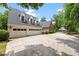 Spacious three car garage with white doors at 305 Lochridge Dr, Roxboro, NC 27573