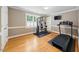 Home gym featuring a window with plantation shutters and work out equipment at 305 Lochridge Dr, Roxboro, NC 27573