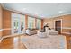 Spacious living room with hardwood floors, area rug, and French doors at 305 Lochridge Dr, Roxboro, NC 27573