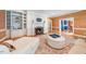 Inviting living room featuring a fireplace, built-in bookshelves, and comfortable seating at 305 Lochridge Dr, Roxboro, NC 27573