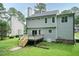 Exterior view showcasing a deck with stairs, perfect for outdoor relaxation and entertainment in the backyard at 3110 Trinness Dr, Durham, NC 27707