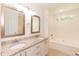 Bathroom with double sinks, granite countertops, and a separate bath and shower at 3110 Trinness Dr, Durham, NC 27707