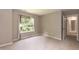 Comfortable bedroom featuring neutral carpeting and bright natural light at 3110 Trinness Dr, Durham, NC 27707