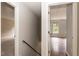 Hallway with hardwood floors and staircase with an upstairs view to a carpeted bedroom at 3110 Trinness Dr, Durham, NC 27707
