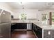 Well-lit kitchen featuring stainless steel appliances, granite countertops, and a window with natural light at 3110 Trinness Dr, Durham, NC 27707