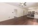 Open floor plan with a kitchen area featuring stainless steel appliances and a combined living room with hardwood floors at 3110 Trinness Dr, Durham, NC 27707