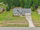 An aerial view of a home featuring a well manicured lawn and landscaping at 33 Bluestone Dr, Smithfield, NC 27577