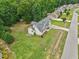 An aerial shot showcasing a well-maintained lawn and home in a residential neighborhood at 33 Bluestone Dr, Smithfield, NC 27577