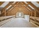 Large attic space with wooden beams and natural light at 33 Bluestone Dr, Smithfield, NC 27577