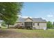 Spacious backyard view showing the deck and back of the home featuring neutral siding at 33 Bluestone Dr, Smithfield, NC 27577