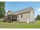View of a home's backyard and deck featuring neutral siding, and lawn at 33 Bluestone Dr, Smithfield, NC 27577