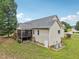 Aerial view of the backyard featuring neutral siding, deck, lawn and foliage at 33 Bluestone Dr, Smithfield, NC 27577
