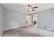 Bedroom featuring plush carpet, gray walls, and a fan above at 33 Bluestone Dr, Smithfield, NC 27577