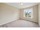 Cozy bedroom with neutral carpet and a view of the outdoors at 33 Bluestone Dr, Smithfield, NC 27577