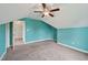 Bedroom featuring plush carpet, teal walls, and a fan above at 33 Bluestone Dr, Smithfield, NC 27577