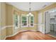Cozy breakfast nook featuring hardwood floors, ample natural light, and views of the backyard at 33 Bluestone Dr, Smithfield, NC 27577