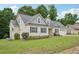 Beautiful home with landscaped yard, showcasing architectural details and a well-kept lawn at 33 Bluestone Dr, Smithfield, NC 27577