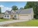 Classic home with a two-car garage, attractive roofline, and well-maintained landscaping at 33 Bluestone Dr, Smithfield, NC 27577