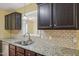 Beautiful kitchen with stainless steel appliances, a tile backsplash, and granite counters, perfect for cooking at 33 Bluestone Dr, Smithfield, NC 27577