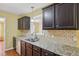 Beautiful kitchen with stainless steel appliances, a tile backsplash, and granite counters, perfect for cooking at 33 Bluestone Dr, Smithfield, NC 27577
