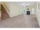 Spacious living room featuring a cozy fireplace and staircase to the second floor at 33 Bluestone Dr, Smithfield, NC 27577
