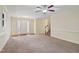 Expansive living room with hardwood floors, staircase, and front door access at 33 Bluestone Dr, Smithfield, NC 27577