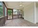 Relaxing screened porch with ceiling fan and wooden floor, perfect for outdoor enjoyment at 33 Bluestone Dr, Smithfield, NC 27577
