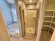 Well-lit bathroom featuring a tub, a shower, and shelving at 3409 Bennyfield Ct, Fuquay Varina, NC 27526