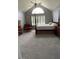 Bright bedroom with vaulted ceilings, large windows, and ample natural light at 3409 Bennyfield Ct, Fuquay Varina, NC 27526