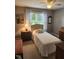 Cozy bedroom with natural light, a single bed, and wooden furniture at 3409 Bennyfield Ct, Fuquay Varina, NC 27526