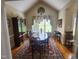Elegant dining room with a large table, hardwood floors, and natural light at 3409 Bennyfield Ct, Fuquay Varina, NC 27526