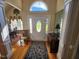 Welcoming foyer with hardwood floors, transom window, and elegant accents at 3409 Bennyfield Ct, Fuquay Varina, NC 27526