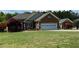 Charming single-story brick home with well-manicured lawn and landscaping at 3409 Bennyfield Ct, Fuquay Varina, NC 27526