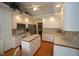 Well-lit kitchen with white cabinets, hardwood floors, and a center island at 3409 Bennyfield Ct, Fuquay Varina, NC 27526