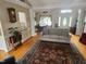 Comfortable living room with a plush sofa, area rug, and hardwood flooring at 3409 Bennyfield Ct, Fuquay Varina, NC 27526