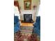 Cozy living room features a fireplace, two comfortable armchairs, and hardwood floors at 3409 Bennyfield Ct, Fuquay Varina, NC 27526