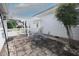 Inviting patio features a metal dining set and a white pergola for outdoor living at 3409 Bennyfield Ct, Fuquay Varina, NC 27526